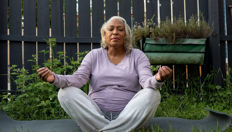 elderly lady practicing meditation
