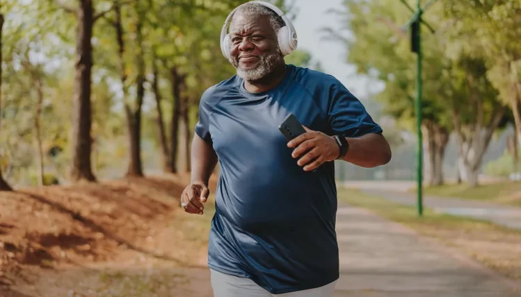 old man jogging with headphones